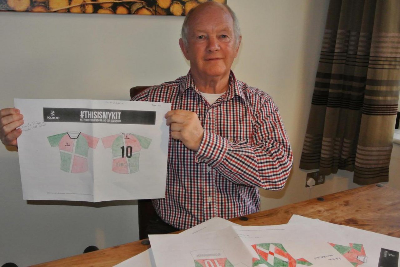 Brian Ashton holding the winning design